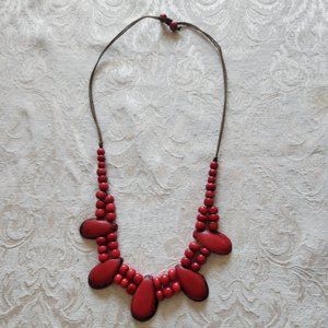 Red Tagua Necklace strung on an adjustable waxed cotton cord